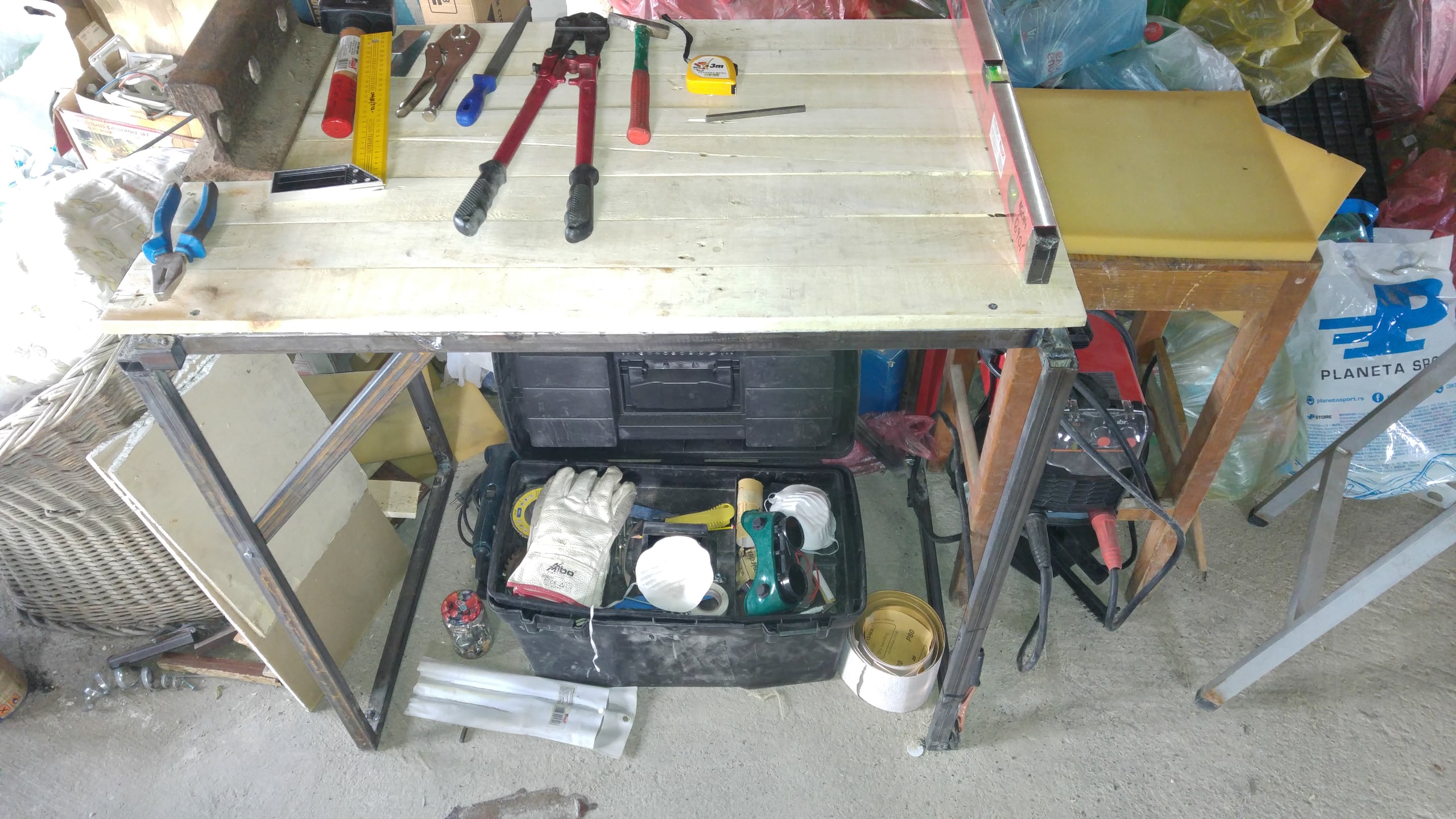 Finished foldable welding table with a pallet-wood top