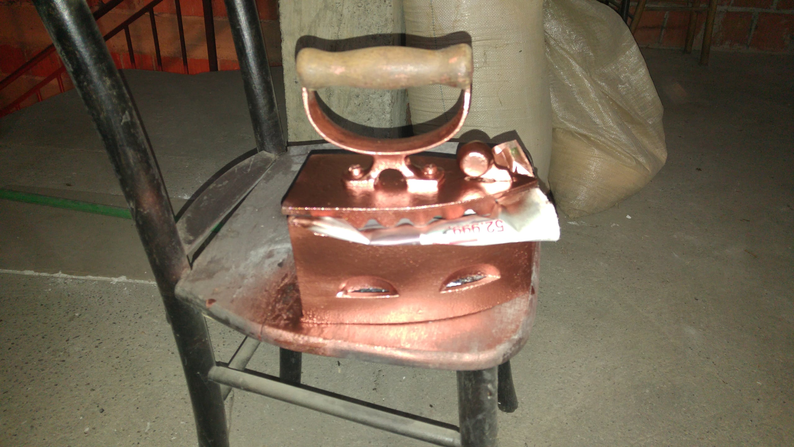 Restored charcoal iron painted copper with a wooden handle